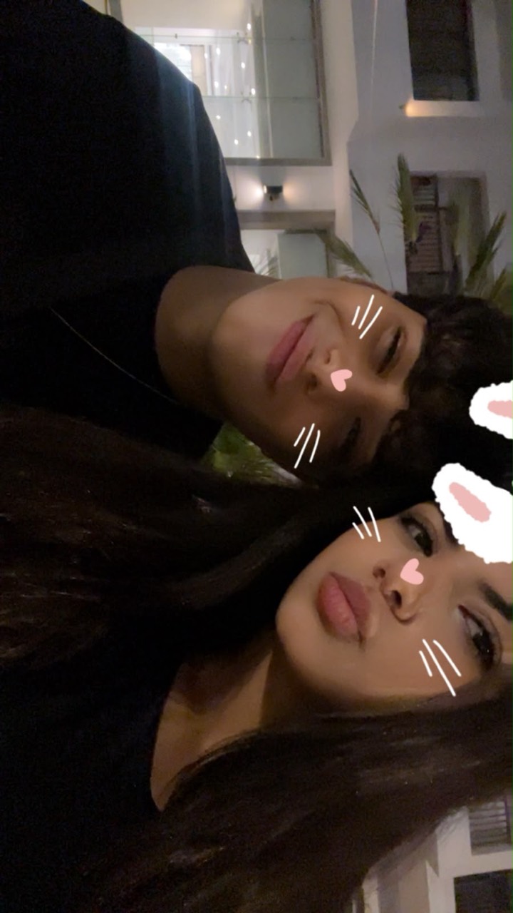 Anas and Farida out at night with a bunny filter